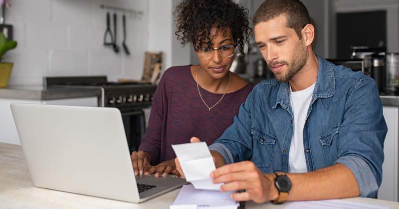Couples double checking receipt their purchase